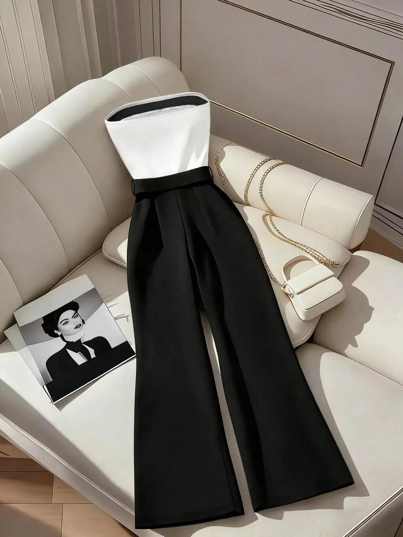 Women's black and white jumpsuit with square neckline and contrast trim, wide-leg pants