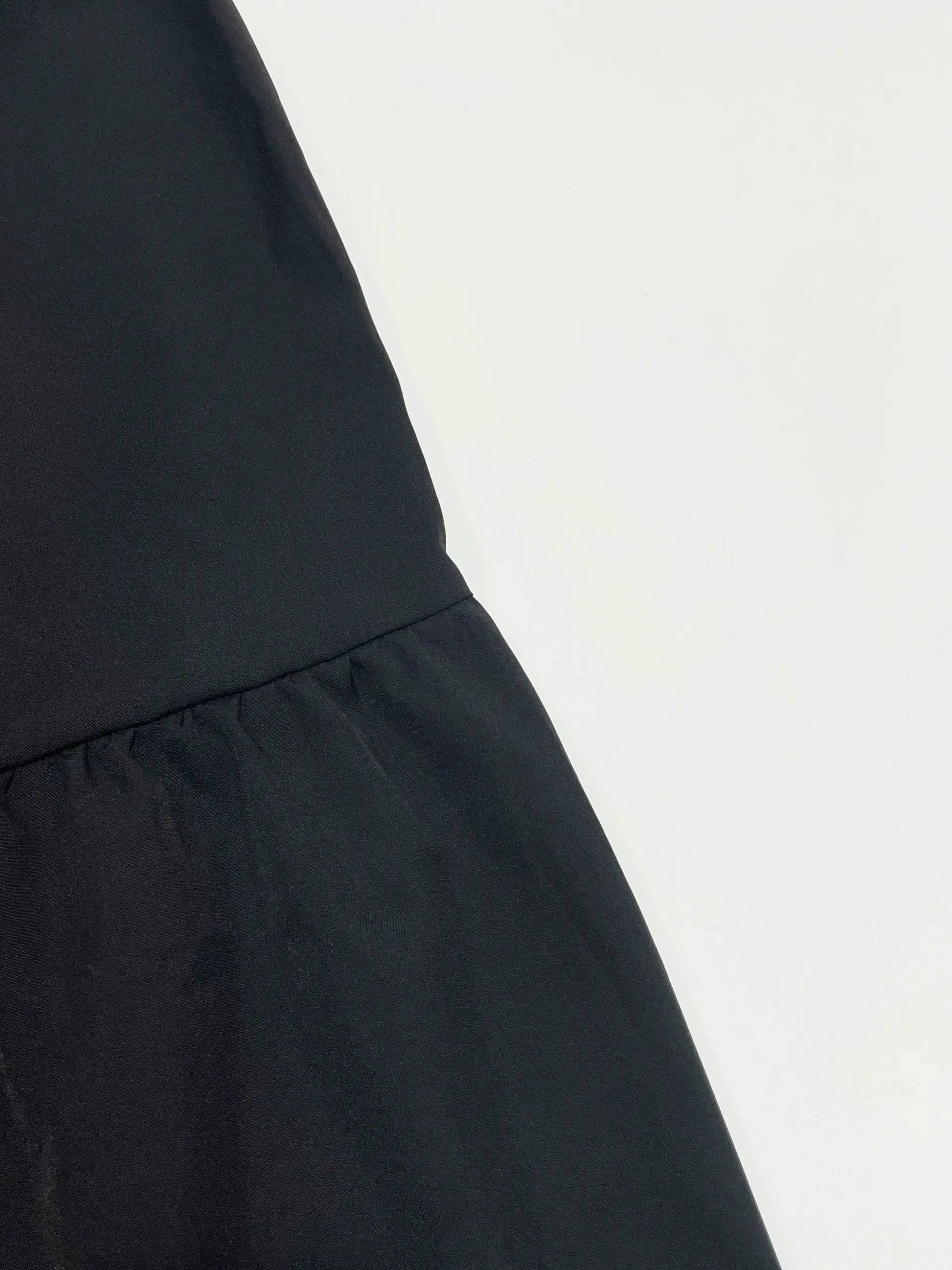 Women's black solid flounce-hem high-waist A-line skirt with stitching detail