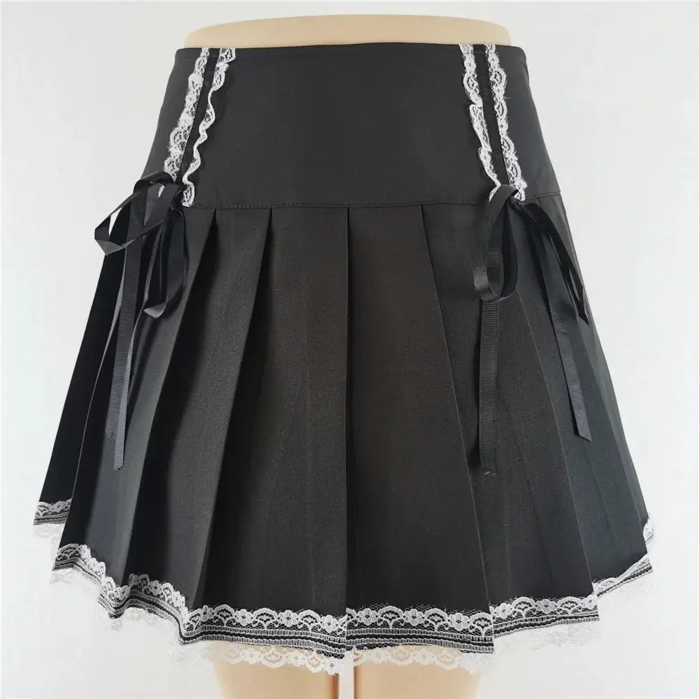 Black high-waisted gothic mini skirt with white lace trim, pleated panels and satin ribbon bows.
