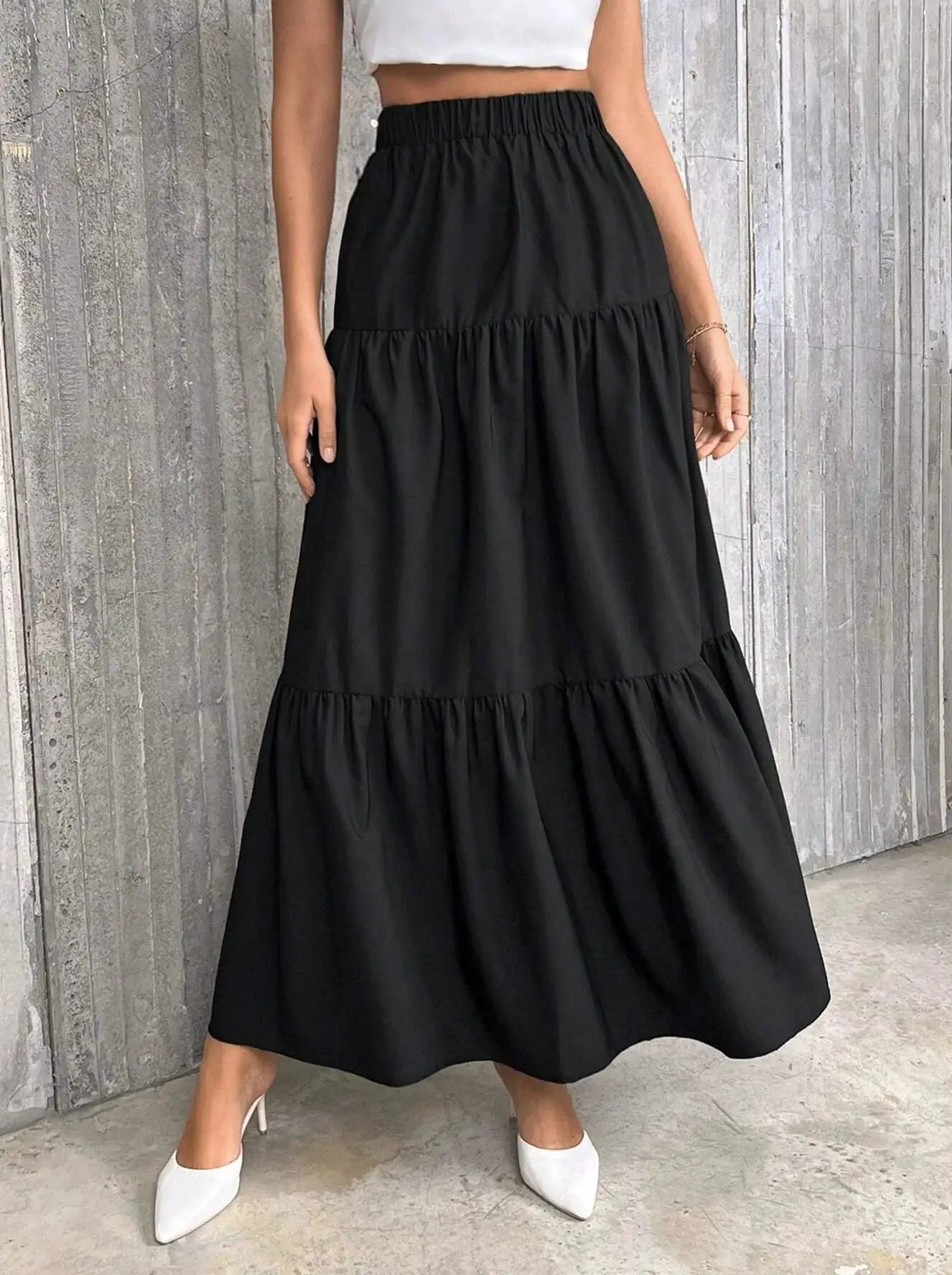 Women's black flounce-hem tiered maxi skirt with a high elastic waistband