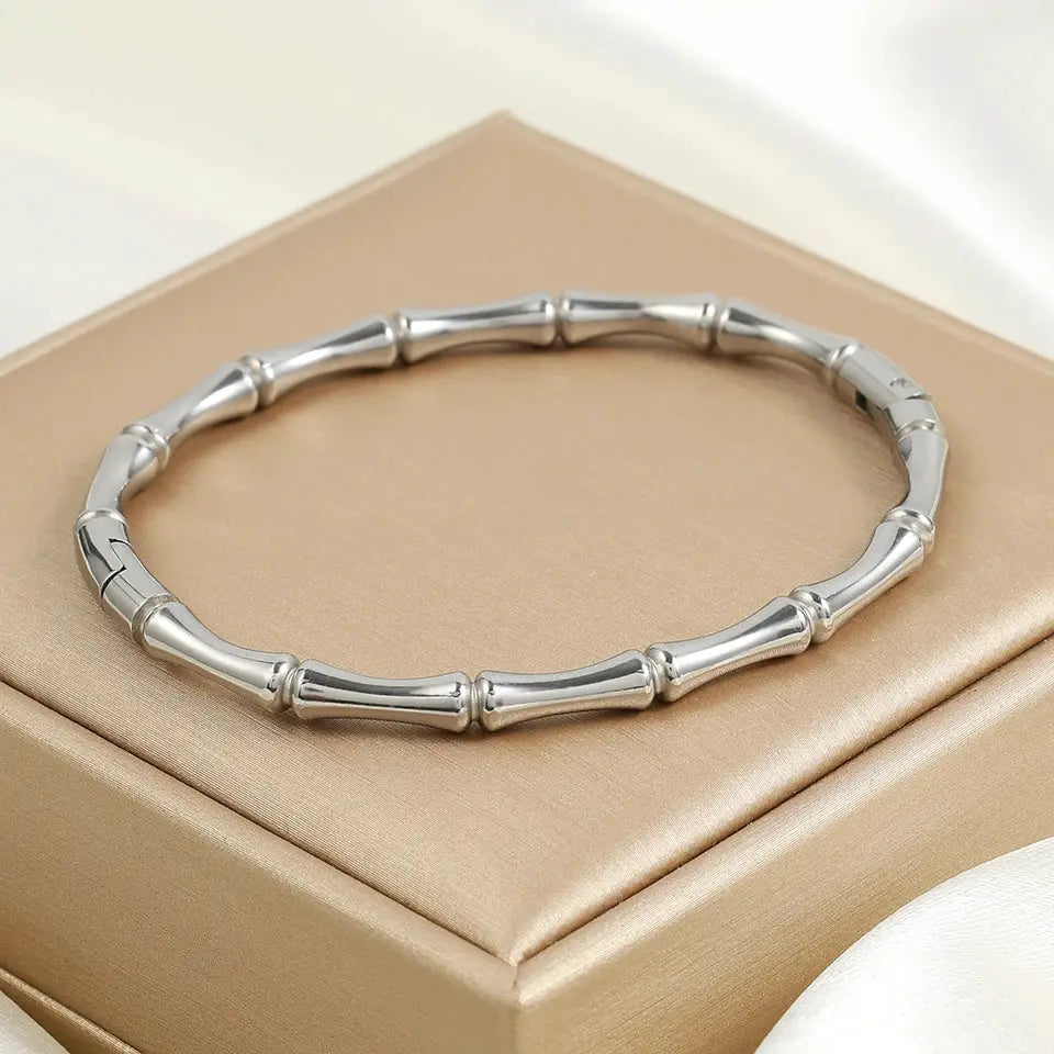 ZAKOL waterproof stainless steel cuff bracelet for women, openable, silver bamboo-link design on a beige jewelry box
