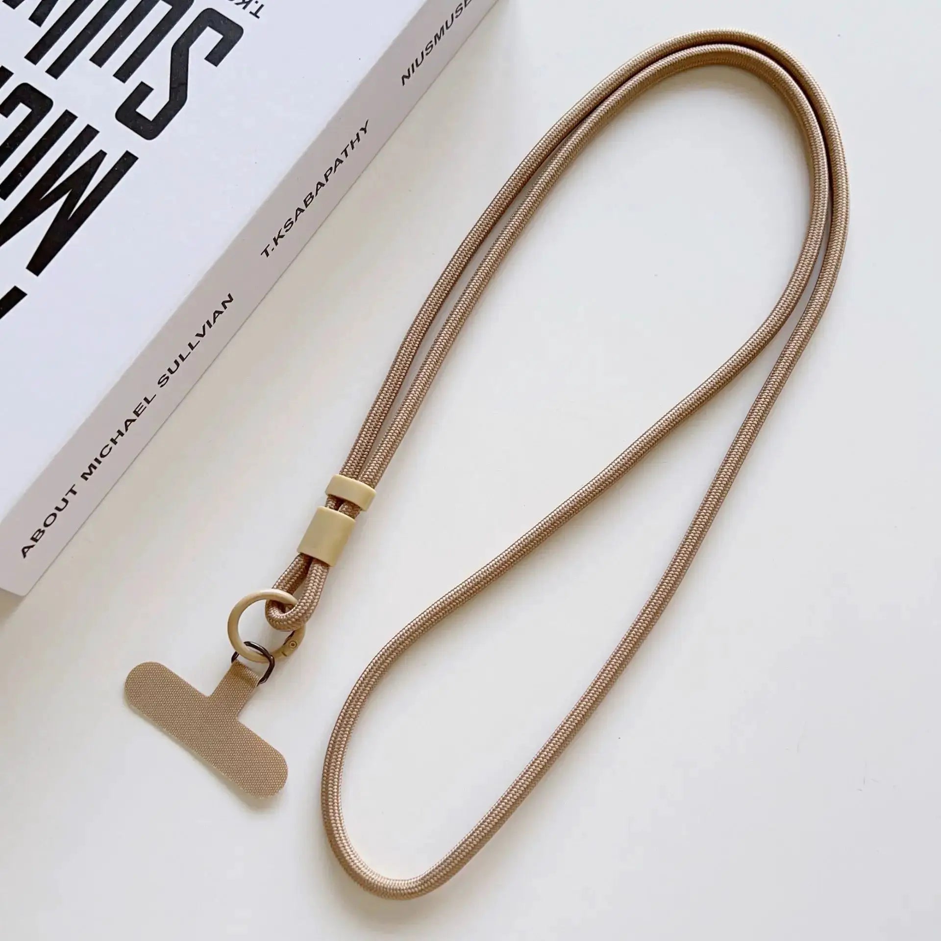 Simples Market rose-gold braided phone lanyard with beige clasp and ring; universal crossbody strap