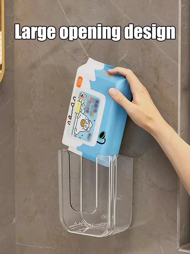 Tissue box wall-mounted storage holder by Simples Market in clear acrylic with large opening and blue tissue box.