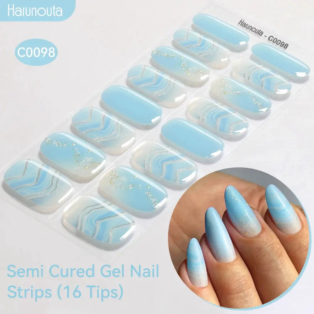 Gradient Auroras semi-cured gel nail strips by Harunouta in blue gradient with silver glitter, 16 tips for UV/LED lamps