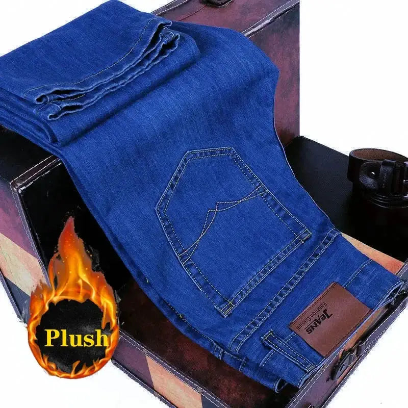 Blue denim jeans for men by Simples Market, folded with back pocket and leather brand patch