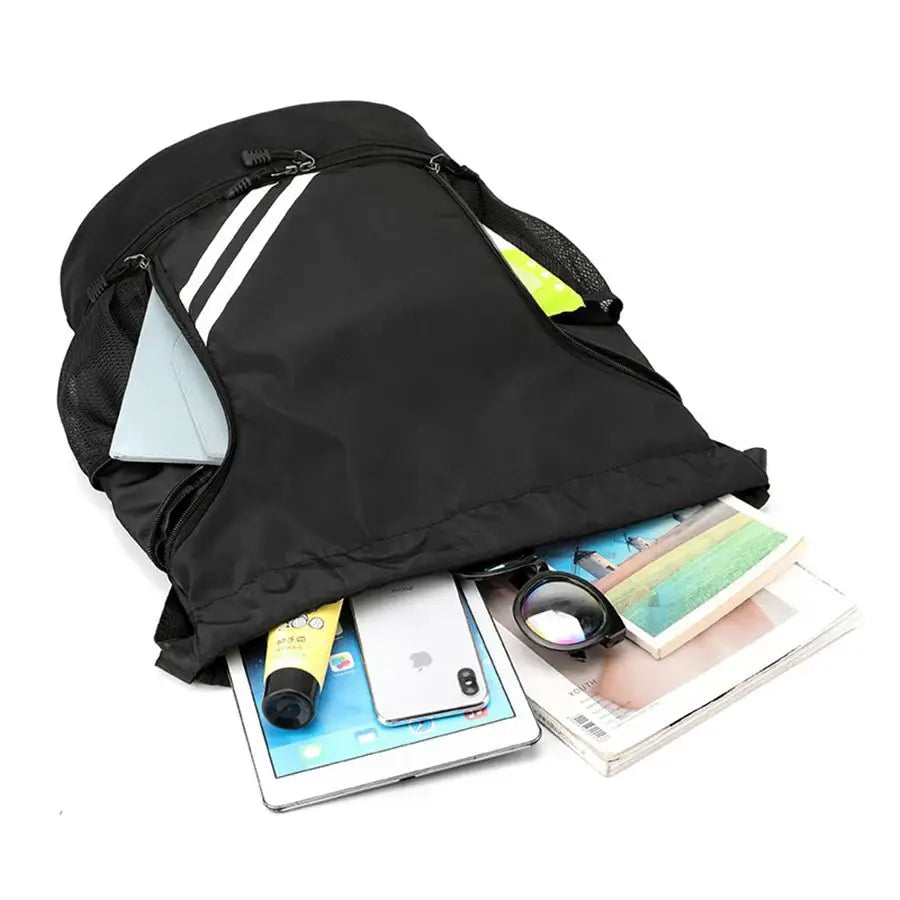 Versatile sports fitness backpack with essentials like tablet, books, and cosmetics showing in the open pocket.