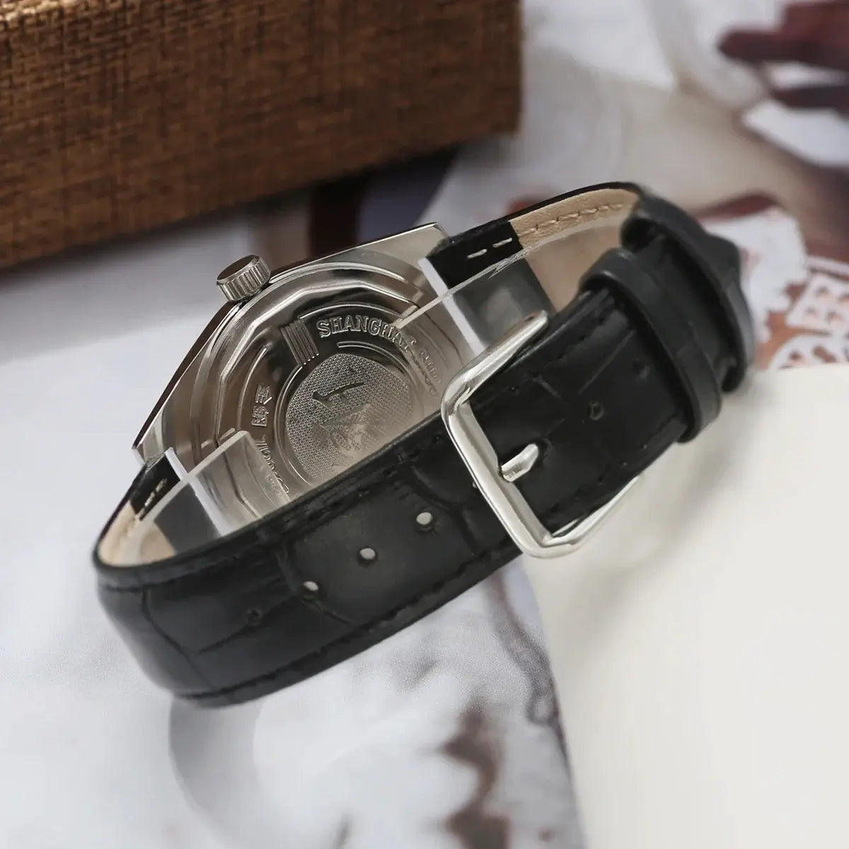 7120 hand-wind mechanical men's watch with black leather strap and silver-tone case back