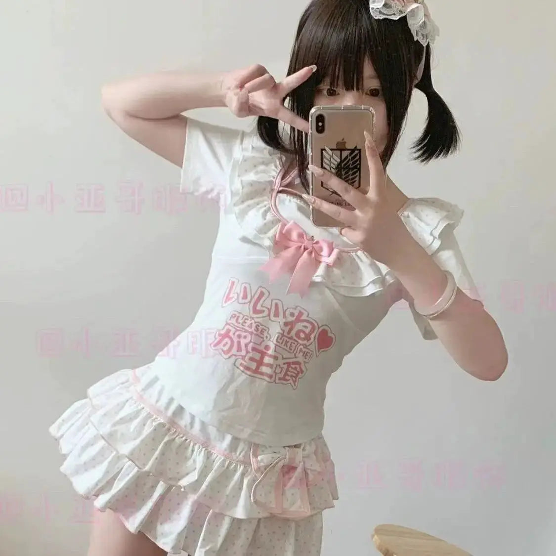 Harajuku Lolita mini skirt outfit in white with pink bow and layered pleated polka-dot ruffle skirt