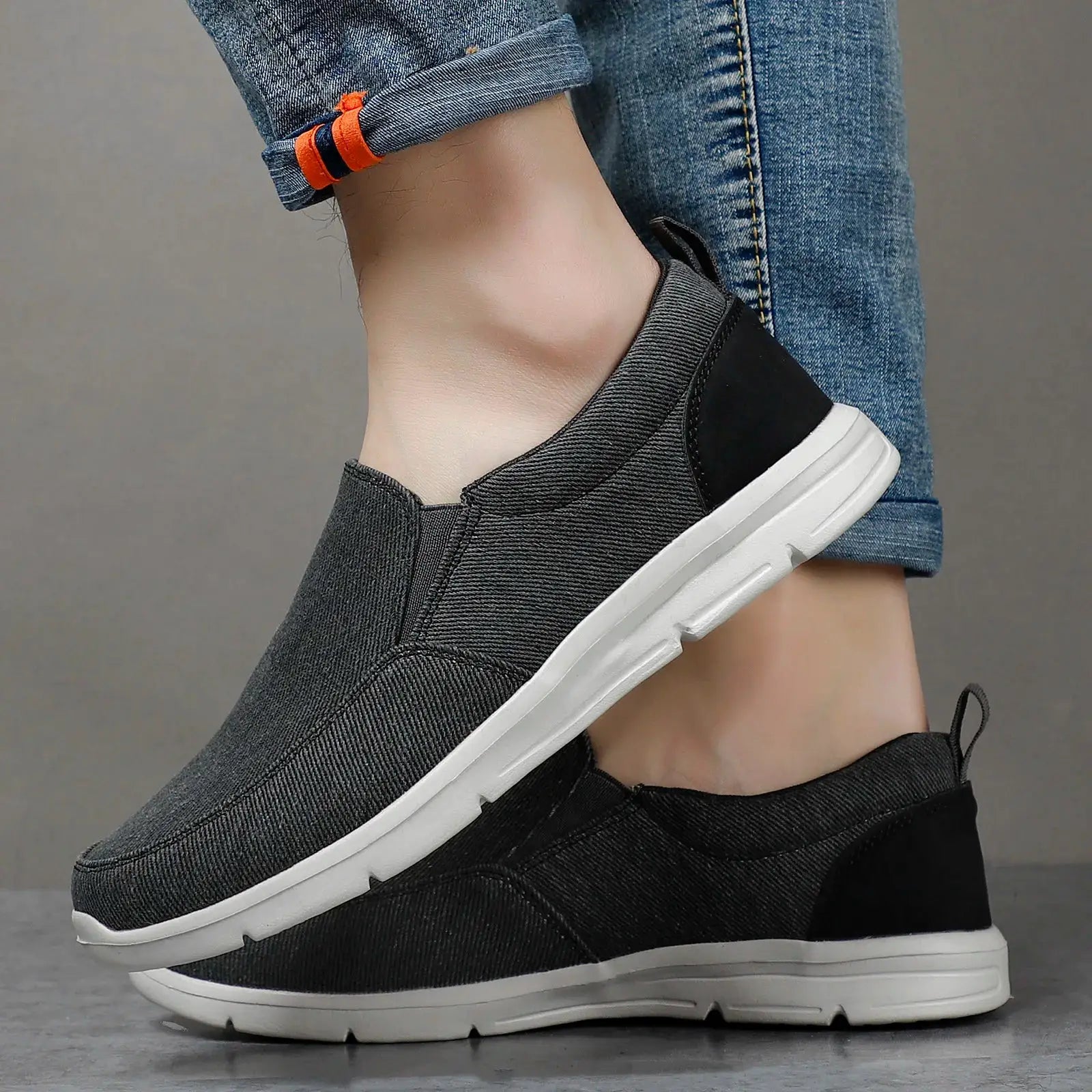 Men's black canvas slip-on sneakers for casual walking, breathable with white sole