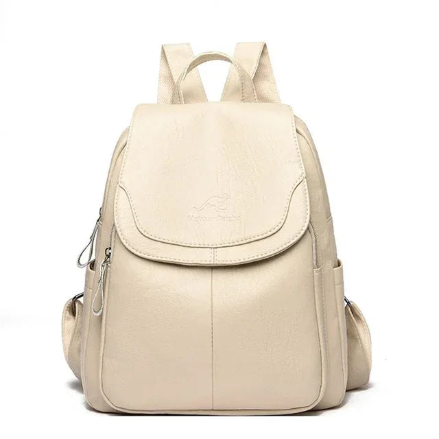 Genuine Women Soft Leather Backpack by Simples Market in beige with front flap and side pockets.