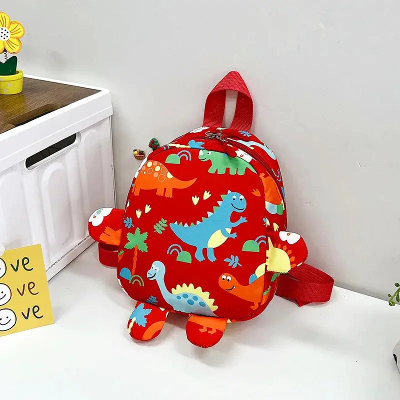 Kids dinosaur backpack, red with colorful cartoon dinos and plush foot accents