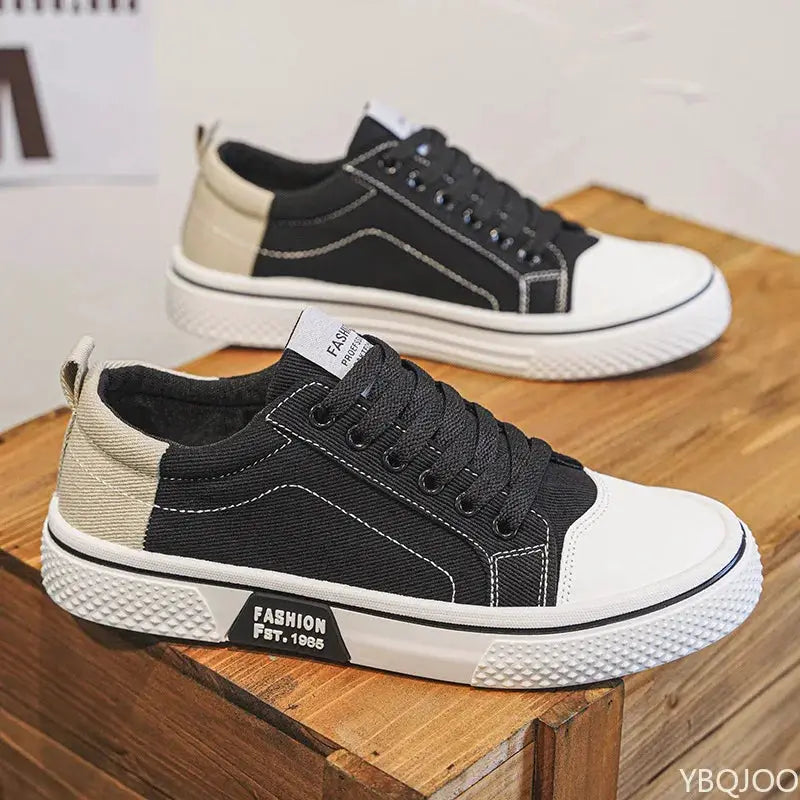 2 black canvas sneakers with white toe caps and beige heel accents, lightweight men’s casual shoes for everyday wear