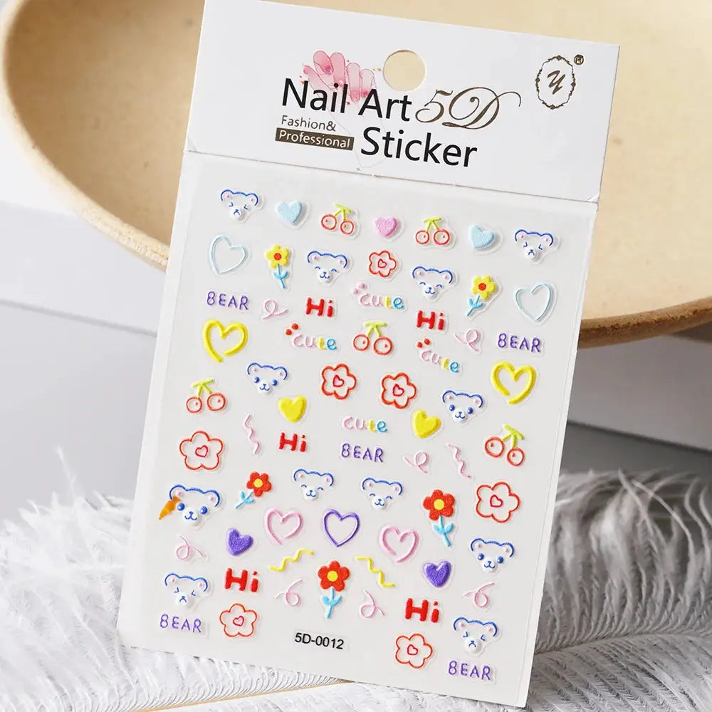 Nail art 5D sticker sheet by Simples Market with bear, flower, heart, and letter decals