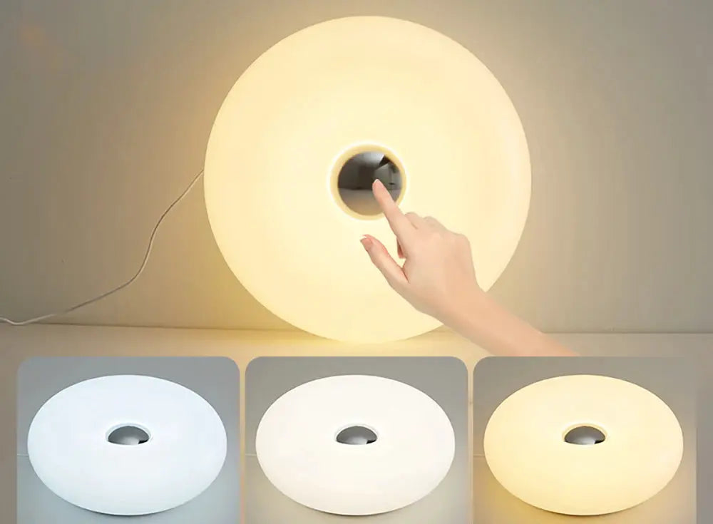 Bauhaus donut table lamp, USB-powered ambient light in three color variants, round white body, Simples Market.