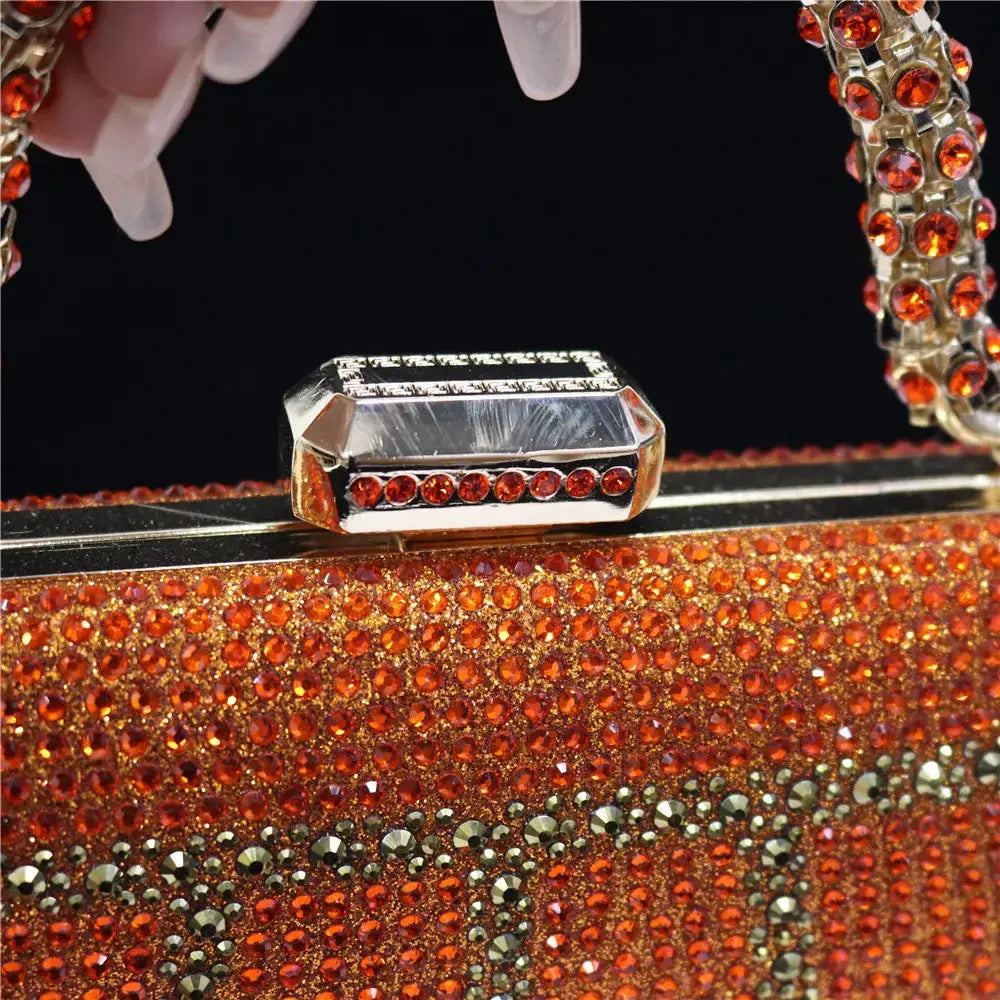 Simples Market evening clutch with orange rhinestones, gold-tone frame, rhinestone-embellished chain strap
