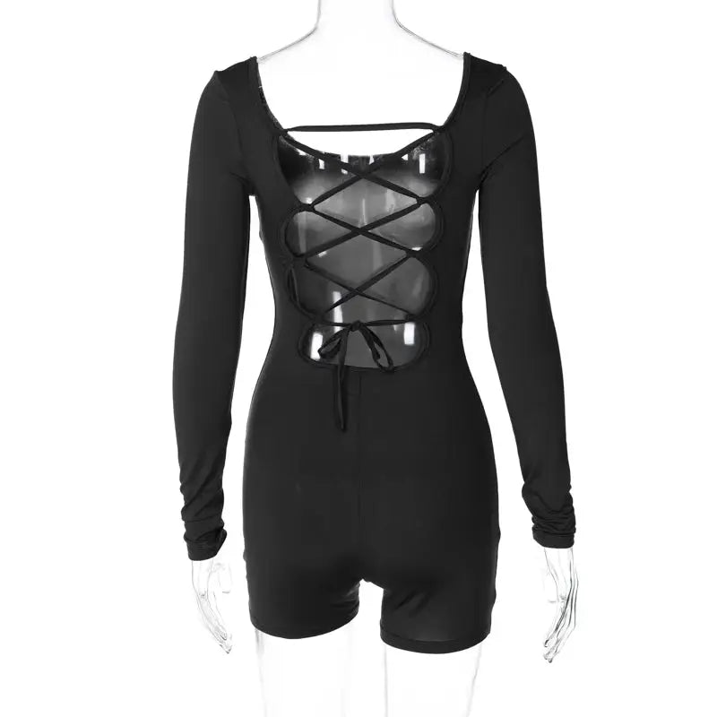 Hugcitar backless lace-up long-sleeve playsuit in black with crisscross front panels and waist tie.