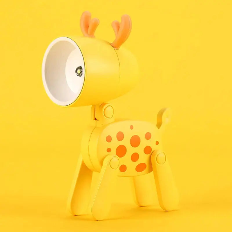 Mini LED night light folding desk lamp in yellow cartoon deer-dog shape with antlers, adjustable for kids' room.