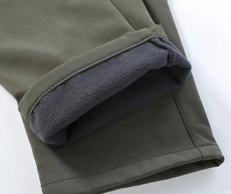 Men's City Cargo fleece-softshell hiking pants by Simples Market, olive green with gray fleece-lined cuffs