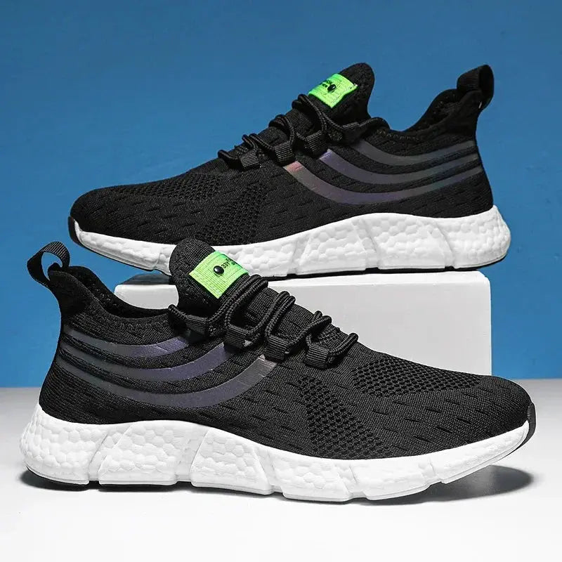 Men's sneakers by Simples Market, black breathable knit upper with white platform sole and neon green tongue tag pair
