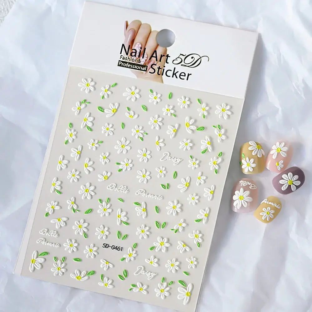 Nail art sticker sheet with embossed 5D white daisies and green leaves for manicure decor