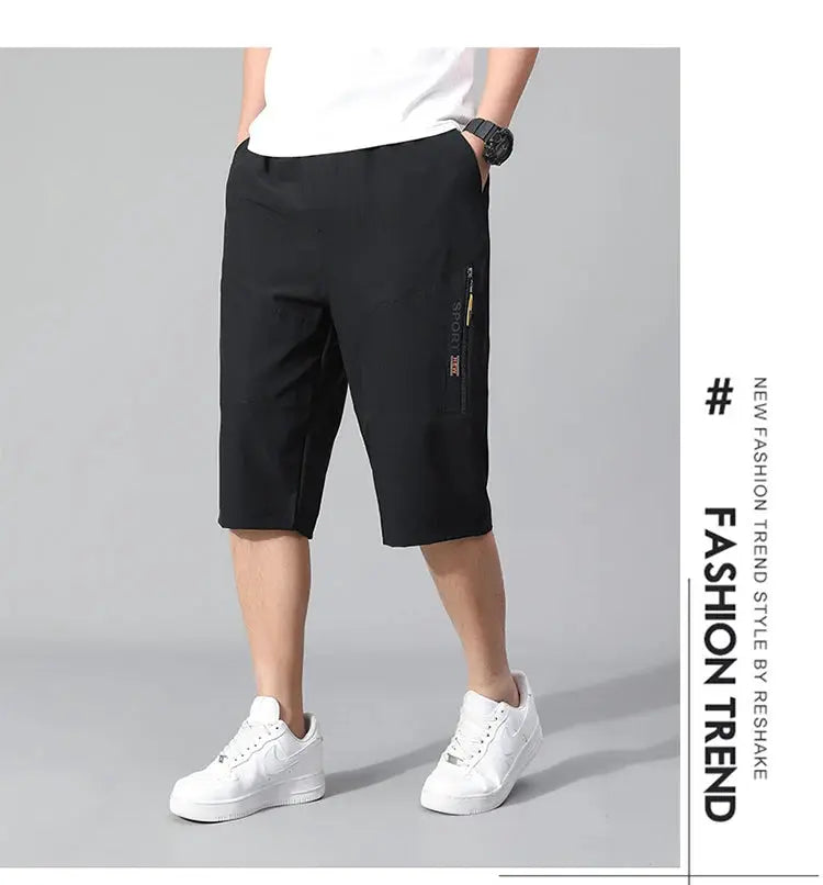 Mens cargo shorts knee-length black cotton with side zip pocket and elastic waistband for casual sportswear.