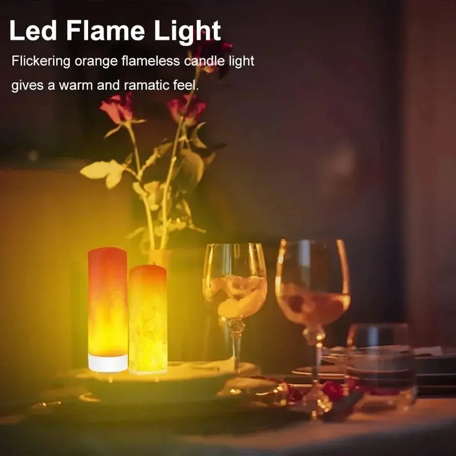 USB LED Flame Light two orange flickering candle bulbs on a dining table beside glasses