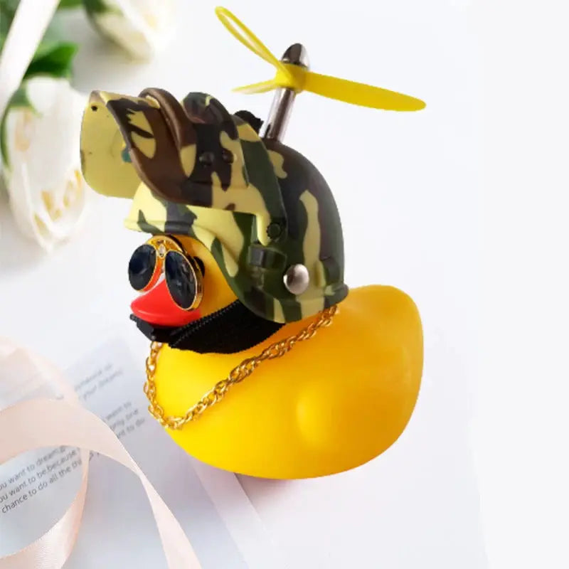 Yellow rubber duck car ornament with camouflage helmet