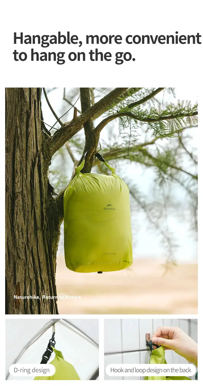 Naturehike rolled storage bag hanging from a tree, lime green, lightweight waterproof vacuum compression organizer