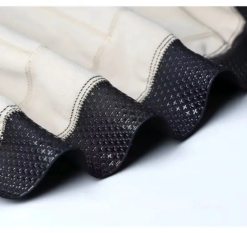 Winter cycling jersey cuff detail: beige outer fabric with dark dotted knit edge
