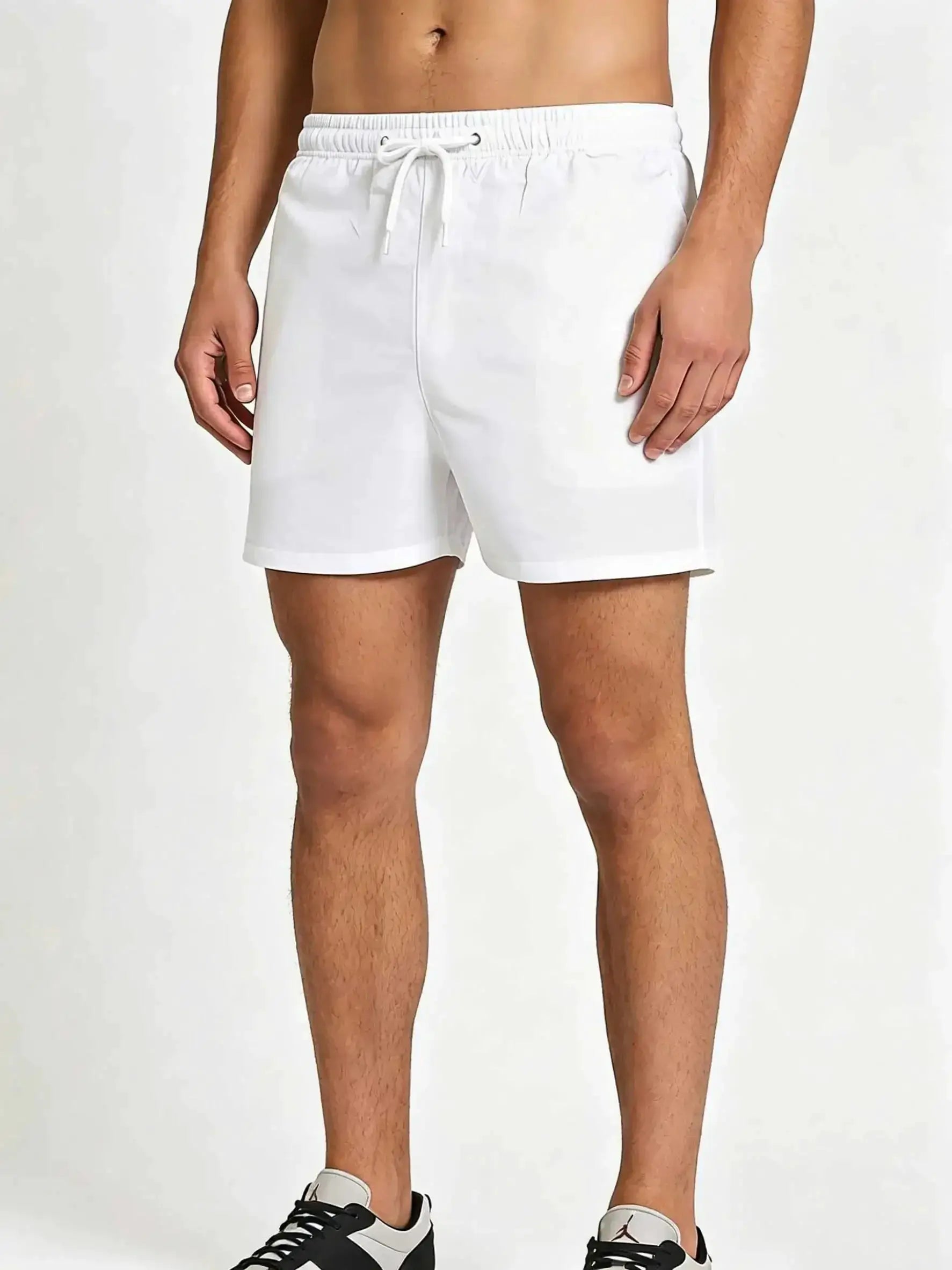 Men's white swim trunks with drawstring, elastic waistband and mesh lining