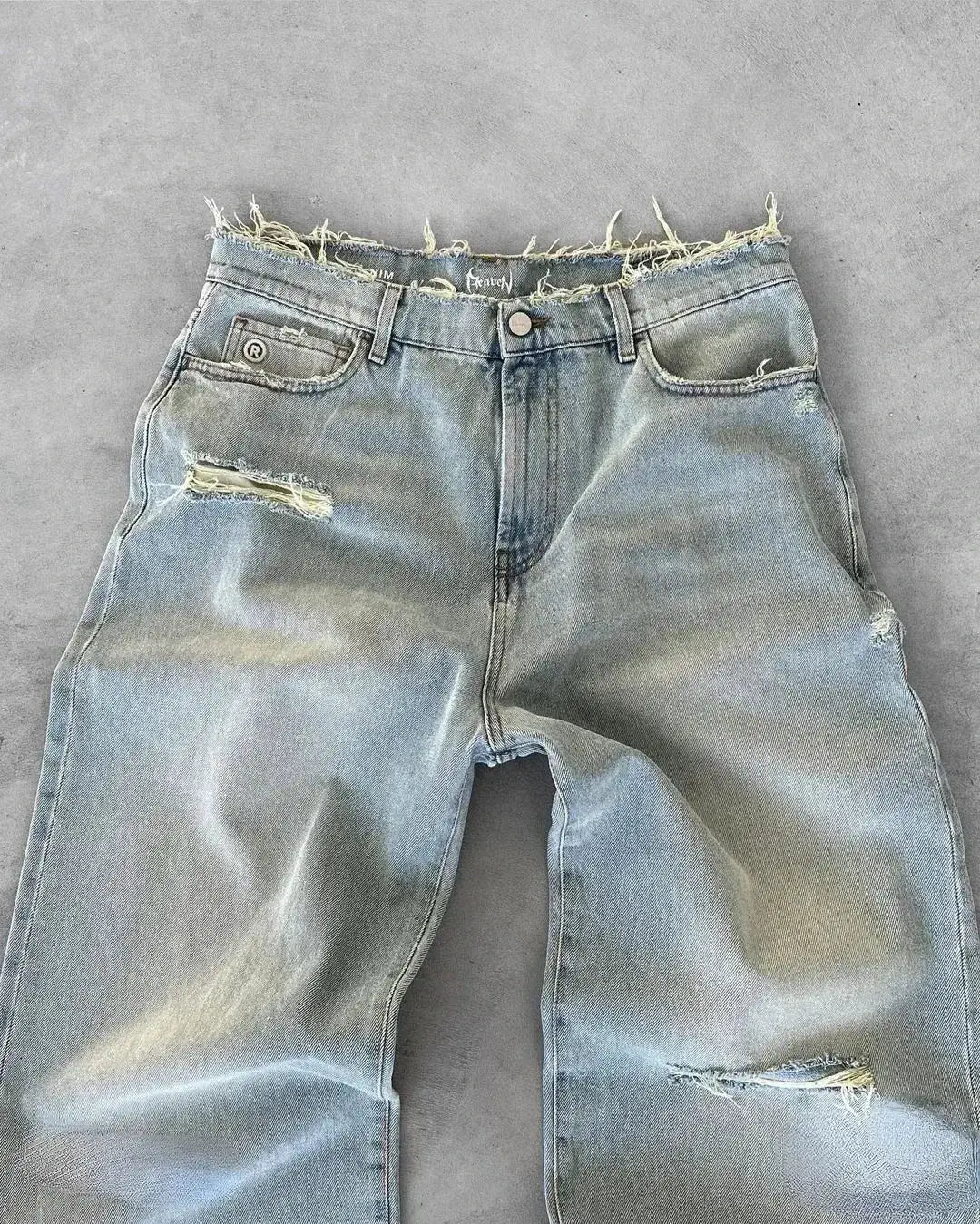 Simples Market men's straight jeans in distressed blue denim with rips and frayed waistband, ankle-length.