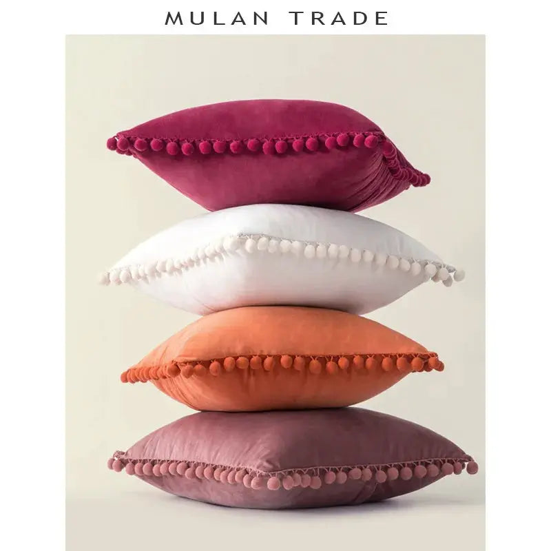 Velvet cushion stack with tassel fringe in magenta, white, orange and mauve (4 cushions)