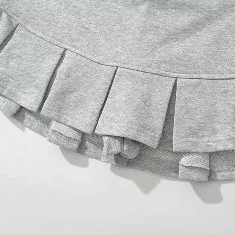 Pleated gray mini skirt with layered hem detail for streetwear style