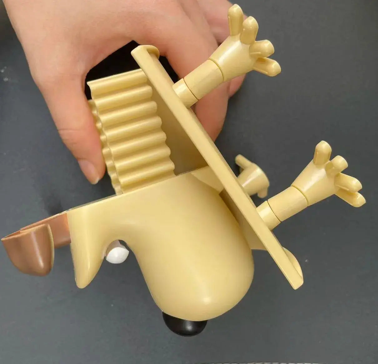 Fun Dog Raccoon Sheep toilet paper holder by Simples Market, beige plastic bathroom decor accessory.