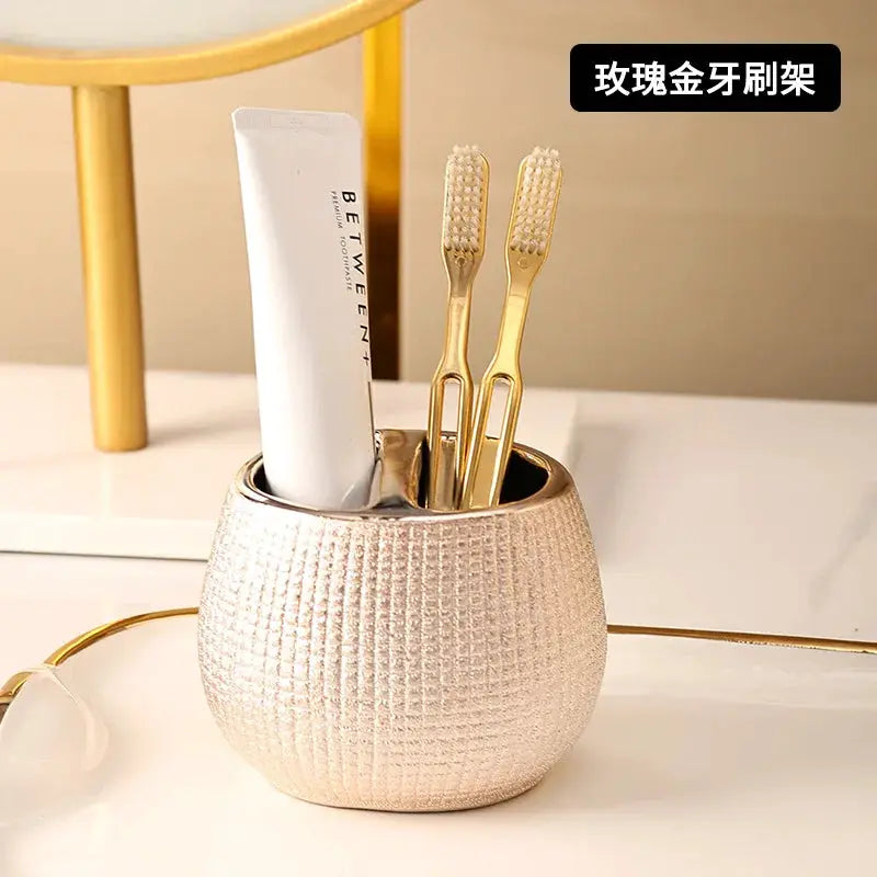 Simples Market rose gold ceramic bathroom accessories set toothbrush holder with toothpaste and two gold toothbrushes