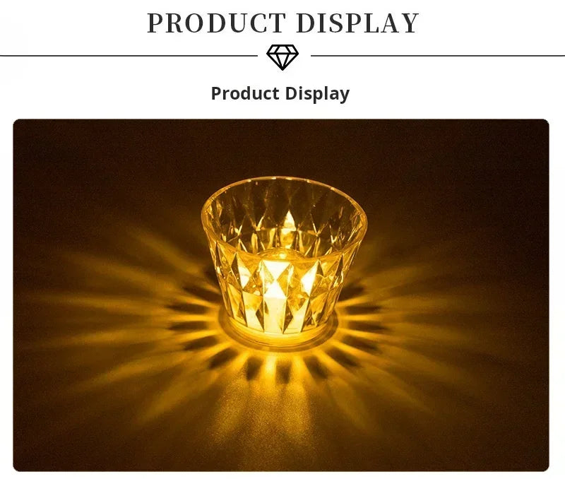 Mini crystal table lamp with a faceted cup emitting a warm amber LED glow.