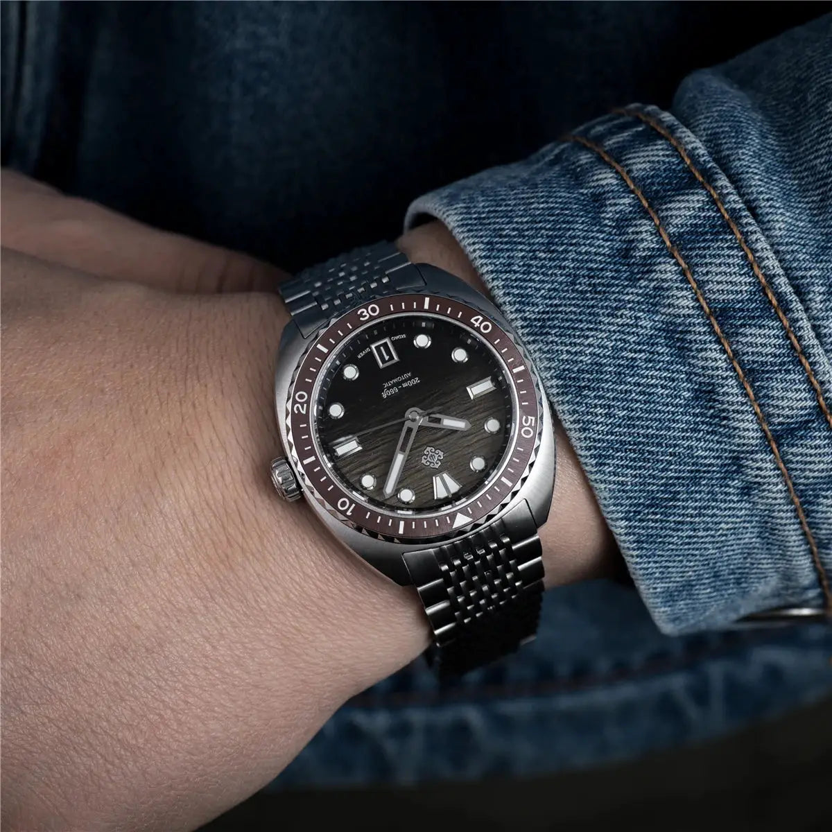 IXDAO IPOSE 2026 men's automatic diving watch with Poseidon pattern, brown bezel, stainless steel bracelet.