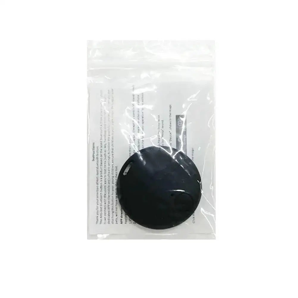 Round black GPS Bluetooth 5.0 anti-lost tracker by Simples Market in plastic packaging