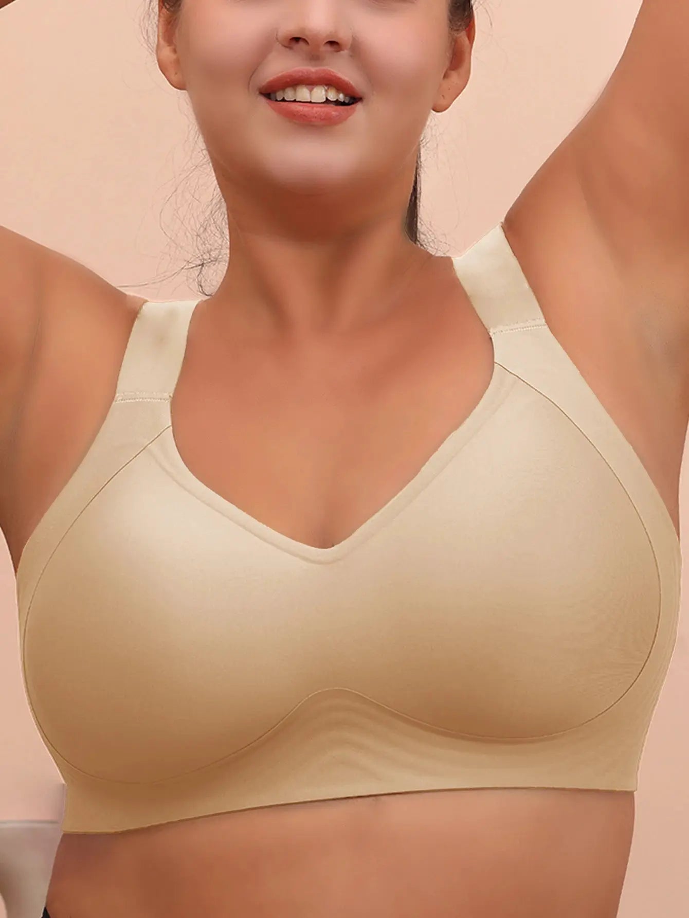 Plus-size beige wireless sleeping bra with wide straps.