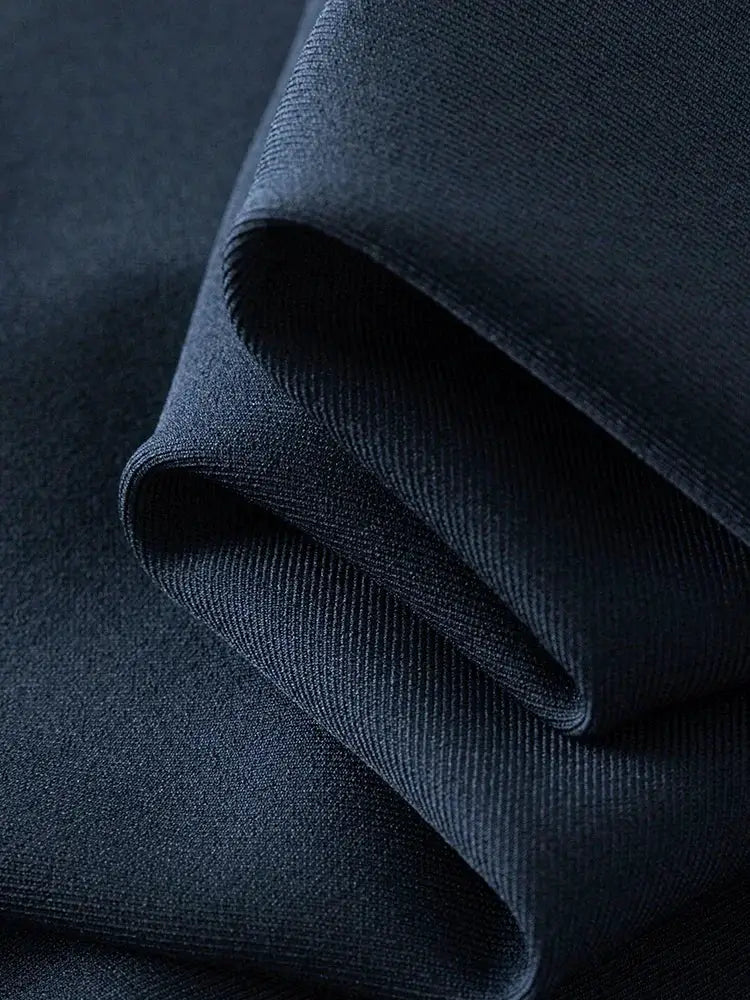 Navy blue skirt fabric with a dense, rich woven texture