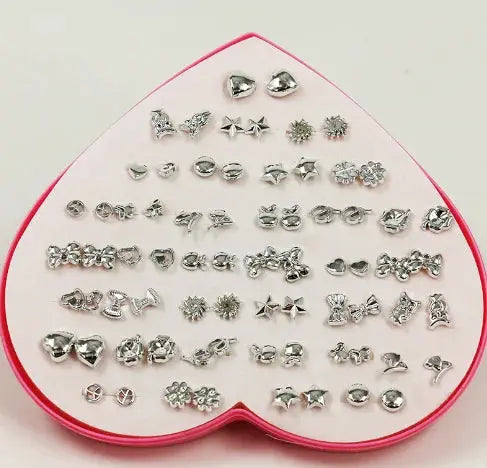 36-pair stud earrings set on a pink heart tray; silver-tone resin studs in snowflakes, butterflies, stars, and flowers