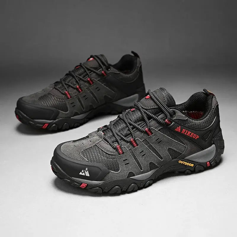 HIKEUP men's hiking shoes pair in black and gray suede with red accents and rugged outsole