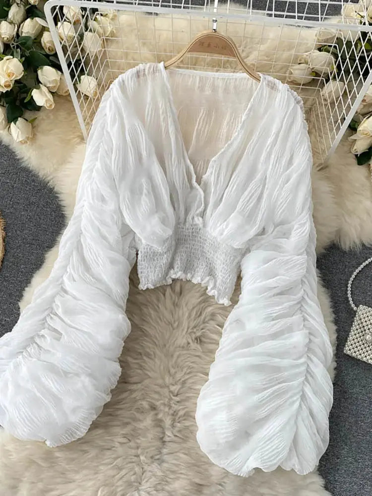 Draped chiffon blouse by Simples Market, white V-neck with puff long sleeves and smocked waist.
