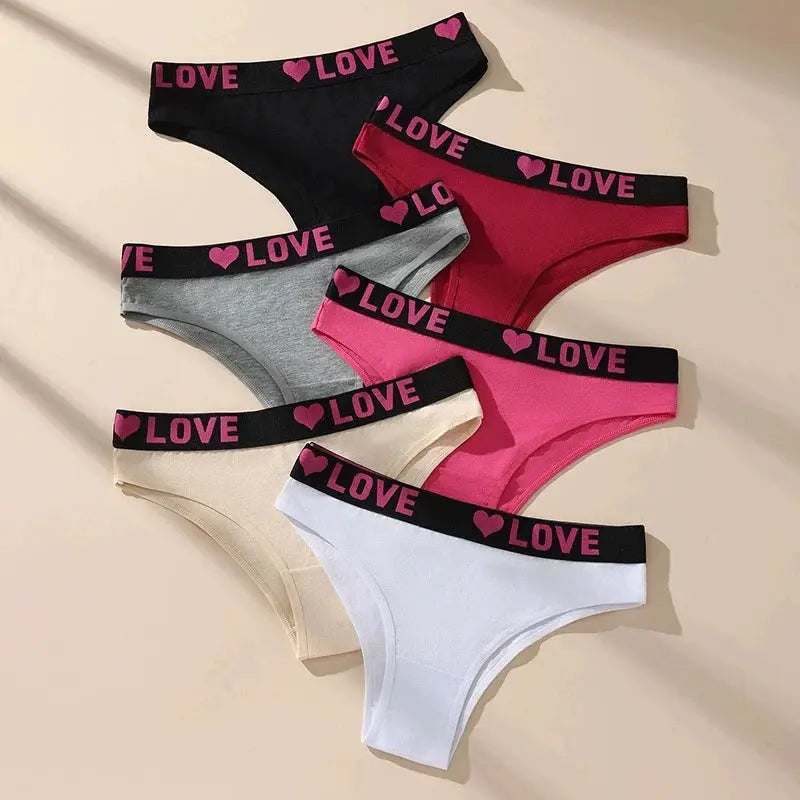 6-pack women's cotton panties by Simples Market with black waistband and pink LOVE hearts in assorted colors.