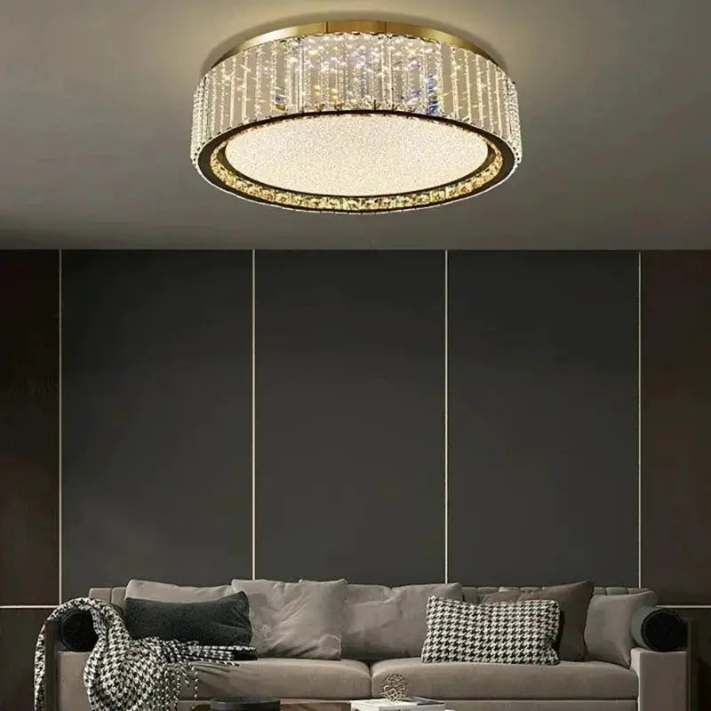 Light luxury crystal ceiling lamp by Simples Market, gold circular fixture with crystal strands