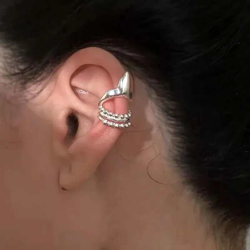 Elf ear clip earring in silver-tone with curved top and stacked beaded wraps