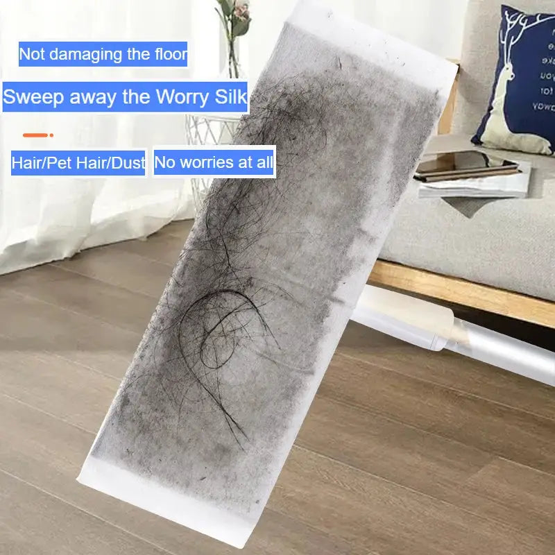 Disposable electrostatic mop pad in gray with dust and hair on it for floor tile cleaning