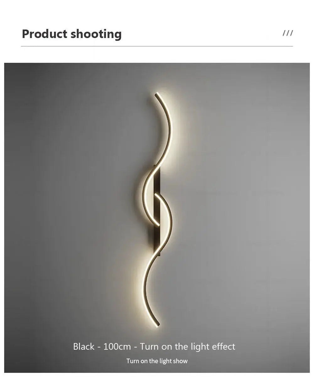 LED wall lamp, black minimalist design with a long curved light strip for bedroom or living room.