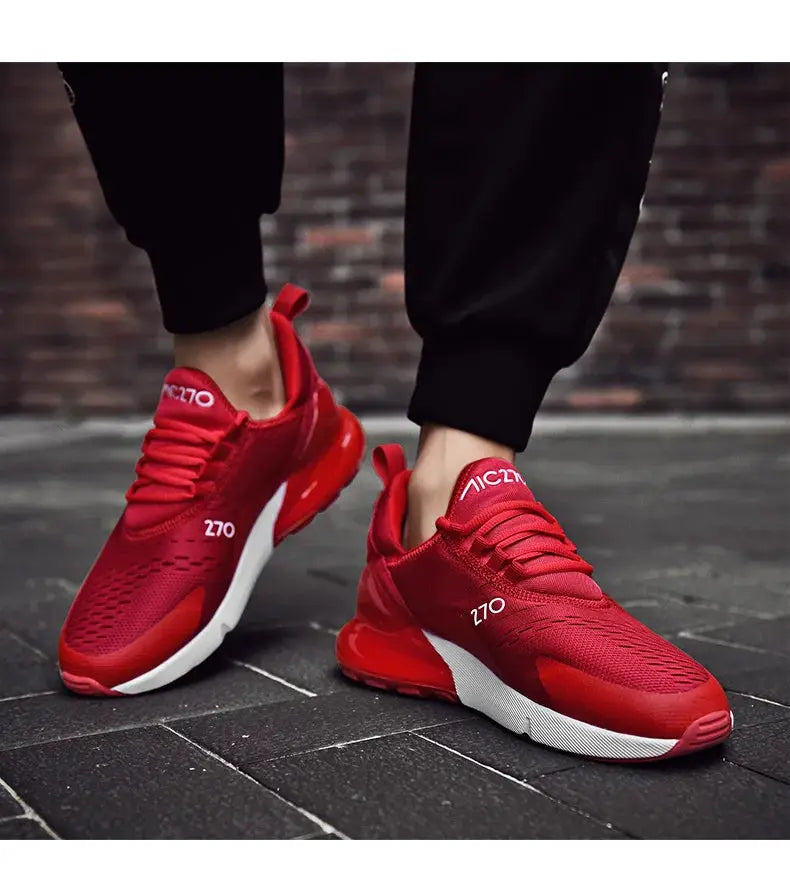 Pair of red mesh running sneakers with white sole for outdoor jogging
