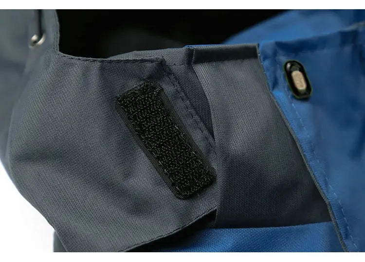 TRVLWEGO men's camping hiking jacket in blue and gray with Velcro cuff tab